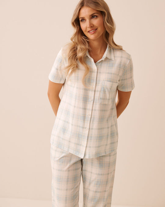 قميص أزرق بنقشة مربعات بأزرار